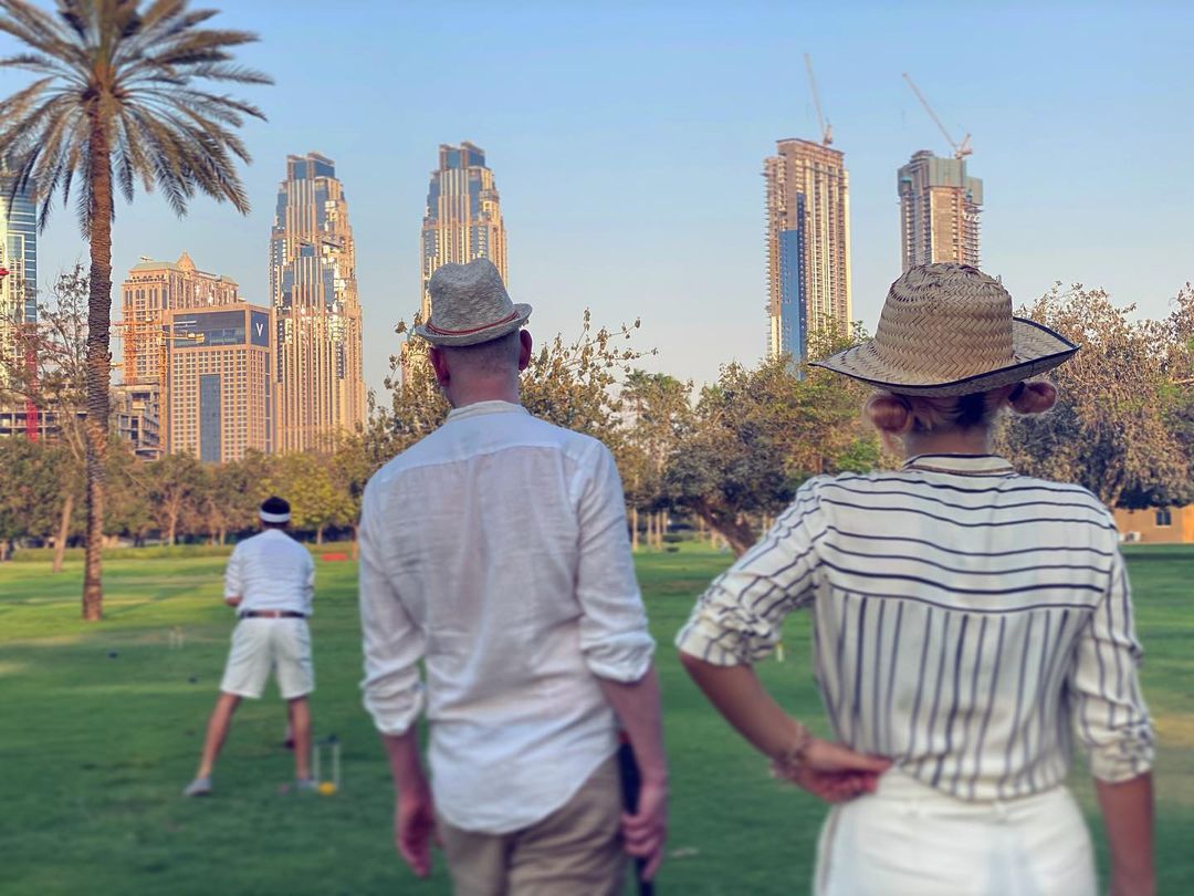 People watching a croquet champion